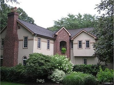 Magnificent Tudor home with professional landscaped grounds.