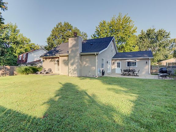Large, level backyard is completely fenced and offers 2 patio's.