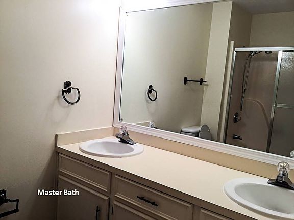 Master bath with 2 sinks, shower enclosure