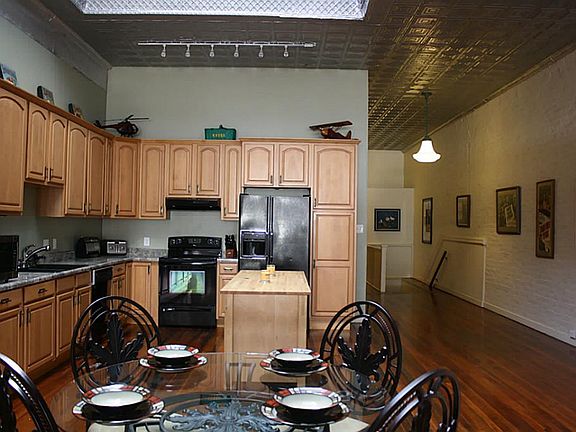 VIEW OF DINING AND KITCHEN AND ART WALL!