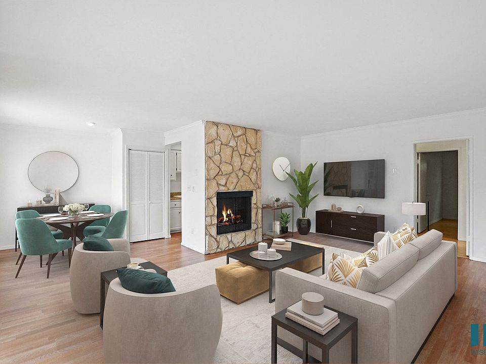 Open-Concept Dining and Living Room with Fireplace