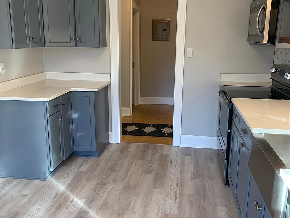 Updated kitchen with brand new stainless steel appliances, new cabinets, and quartz countertops.