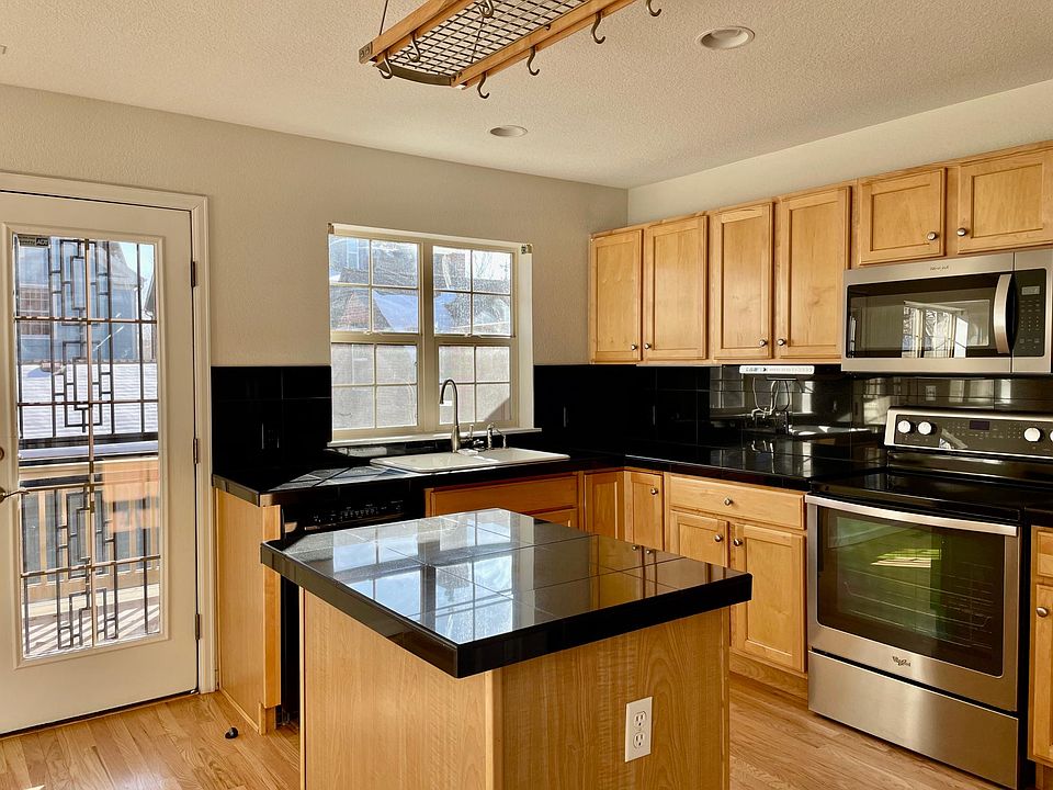 Kitchen has lots of cabinets, ample counter space and stainless appliances