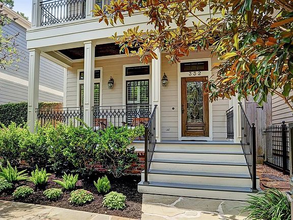 Beautiful landscaping frames this charming home.