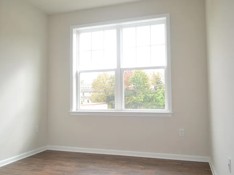 One of the three bedrooms with a view of Cleveland Ave.