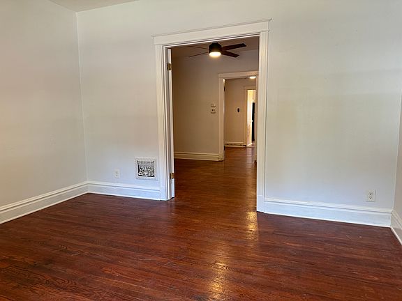 Original hardwood floors carry through the apartment.