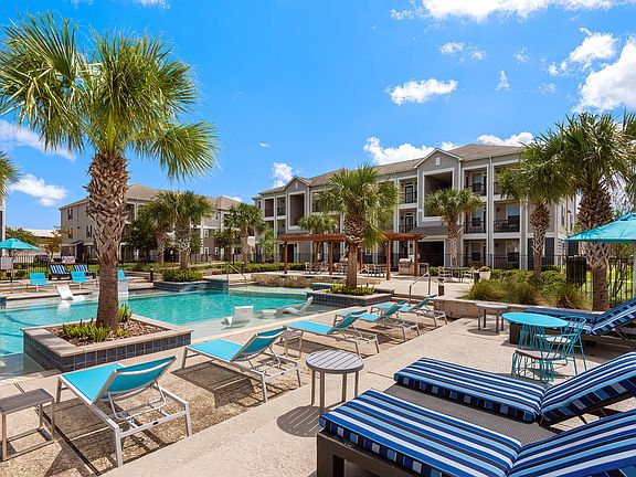 Resort-Style Swimming Pool with In-Pool Loungers at The Retreat, Corpus Christi, TX