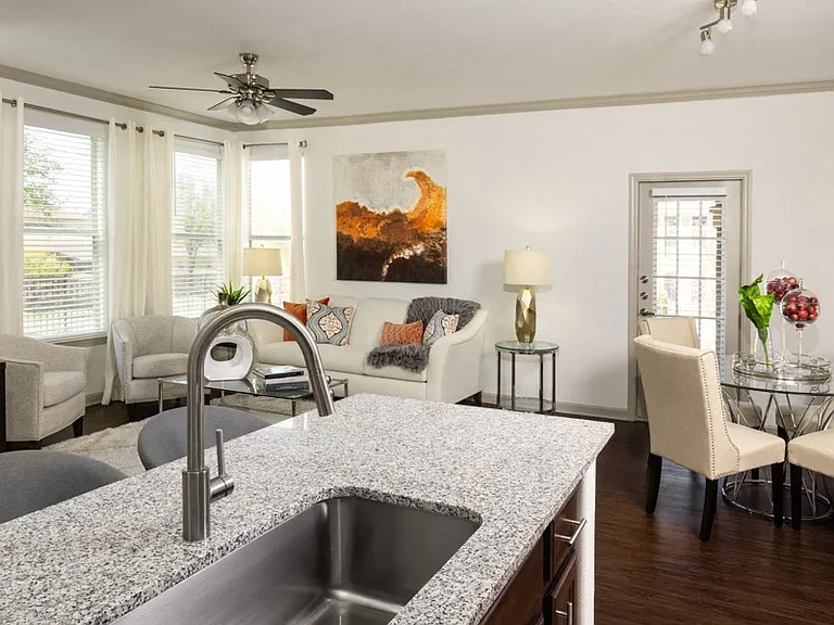 Living rooms and bedrooms feature ceiling fans