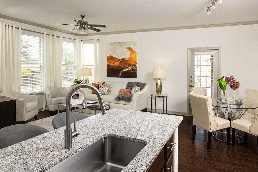 Dining and living rooms feature luxury vinyl plank flooring