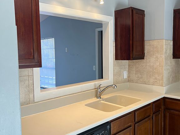 Kitchen with Corian countertops.