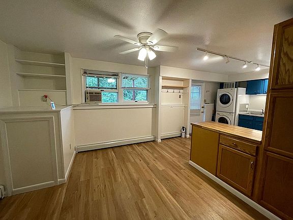 Dining area and storage cabinets that are part of kitchen island.