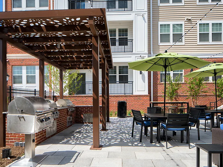 Courtyard for outdoor living, offering gorgeous water feature, cabana, pergola lounge area and grilling station