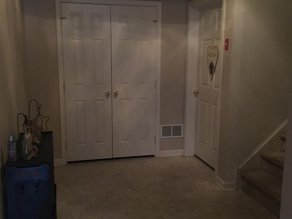 entryway with hall closet, garage access and additional stor
