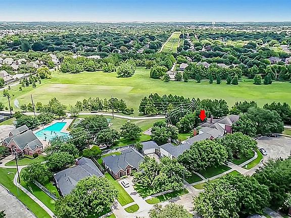 Great aerial photo of cul-de-sac street and location of home to the community pool, park, trail and sports field.