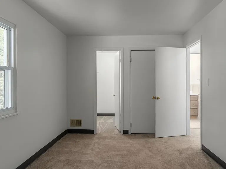 Primary Bedroom with walk-in-closet.