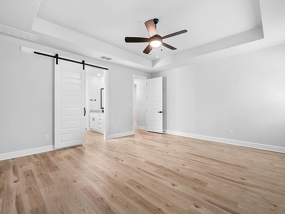 Master bedroom with barn door