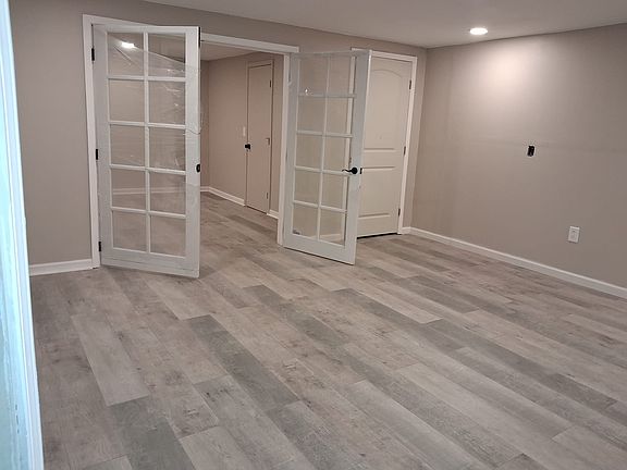 Entrance to bedroom with new French double doors (still in plastic wrap)