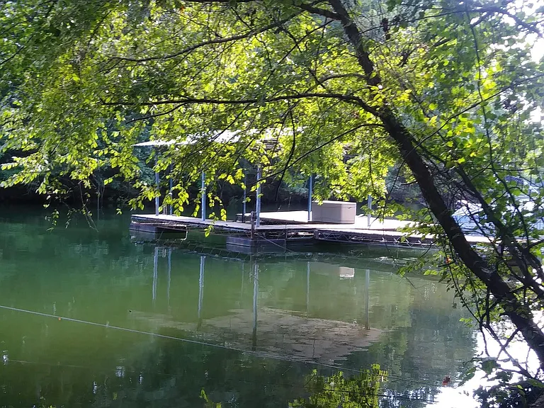 Single sip cover dock with a dock box... so much fun for fishing, kayaking, paddle boarding, or whatever grabs you.