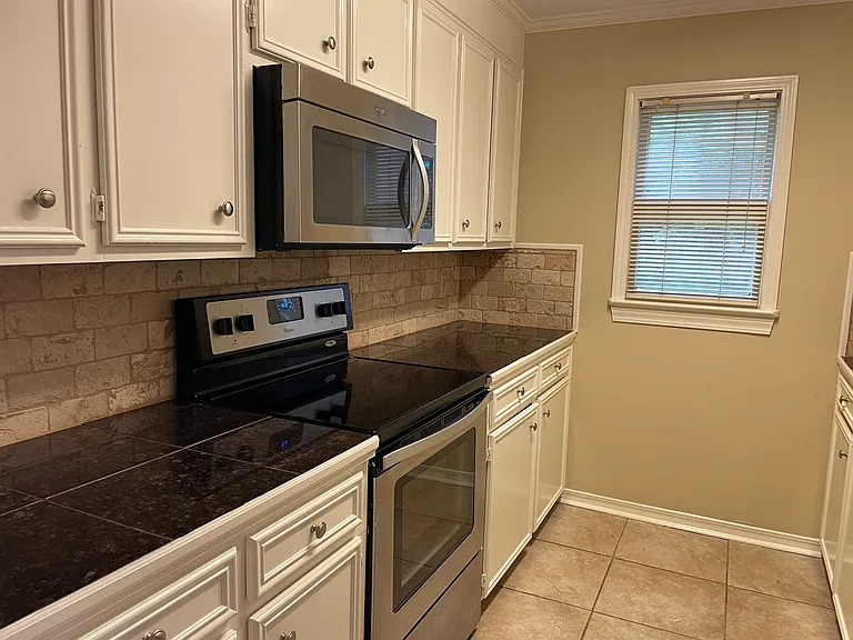 Kitchen with stainless steel appliance