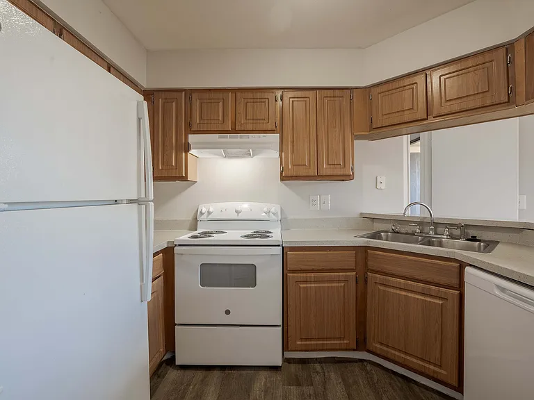 Step into culinary delight with this charming kitchen, featuring modern amenities and classic wooden finishes.