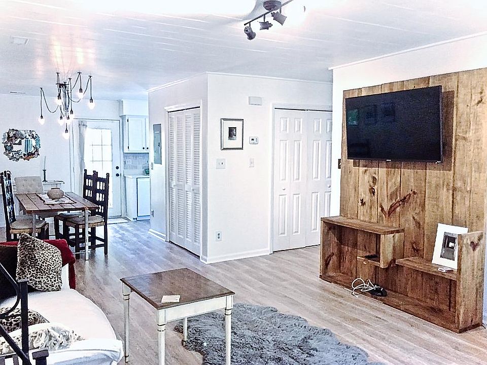 Living room with hand-crafted entertainment center and 55" T.V.