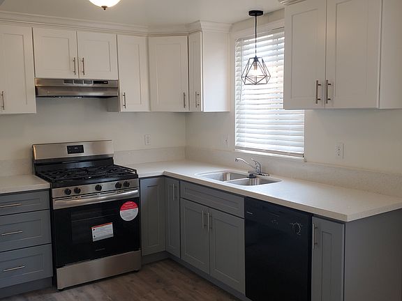 New White and Grey Cabinetry for a designer look.
New Quartz countertops.