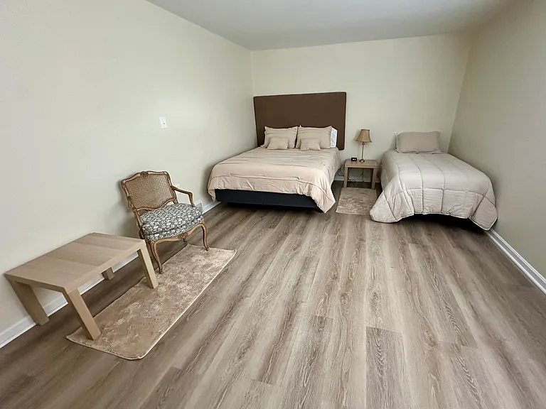 Master Bedroom With A Queen Bed and Single Bed