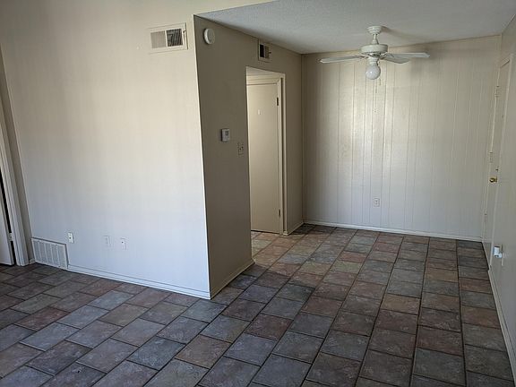 View of dining area from living room. The door on the left goes to the kitchen.