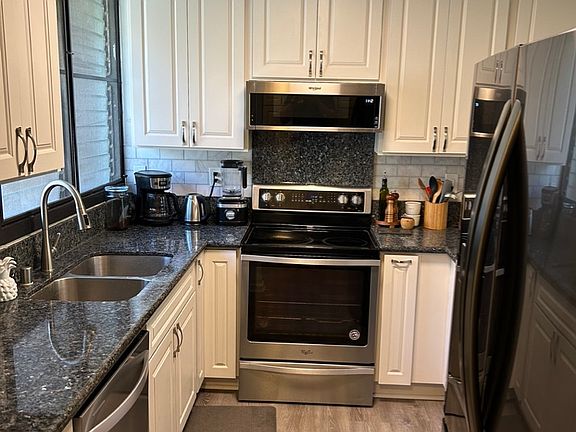 Kitchen with all new appliances, flooring, and cabinets.