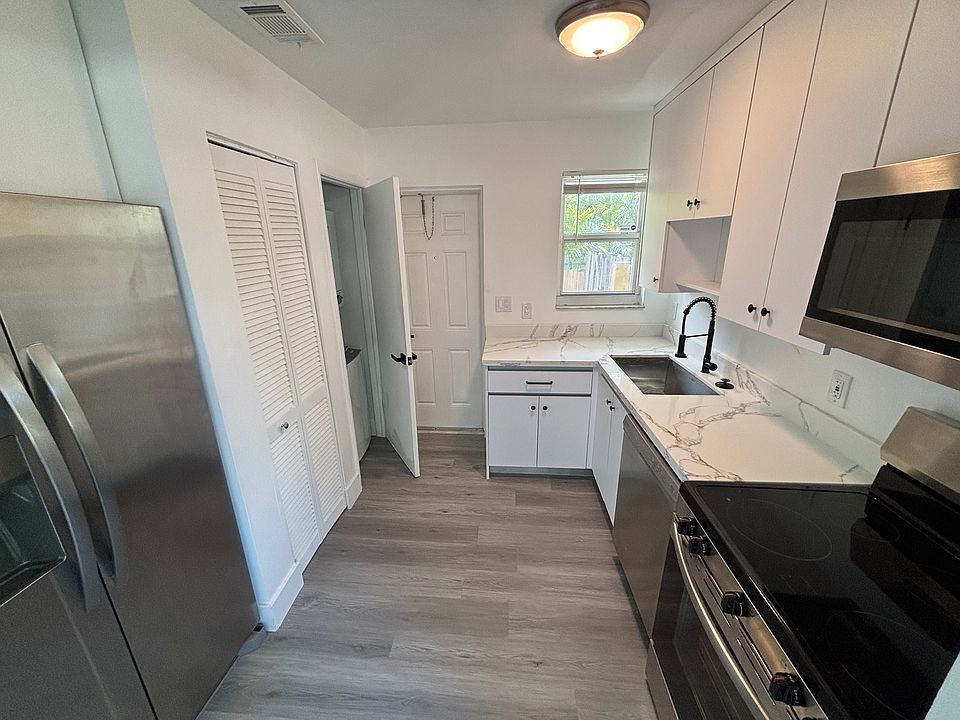 Kitchen with laundry closet door open