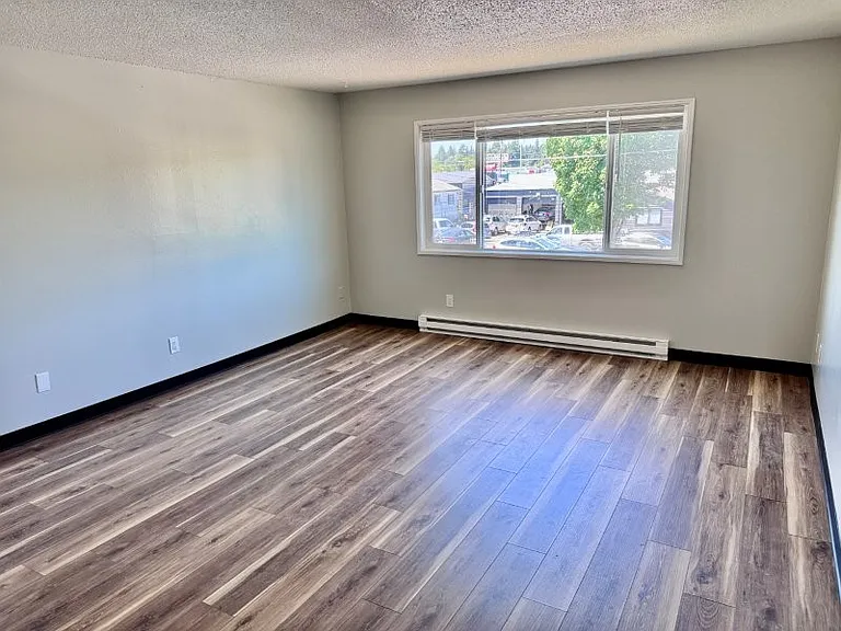 Large main living space with fan, looking North