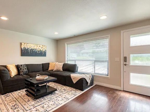 Another view of the living room. Modular couch can be rearranged to a bed if needed