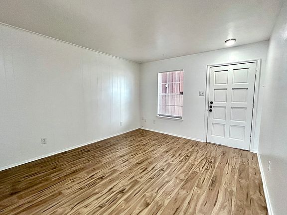 Living Room - All NEW flooring and lights.