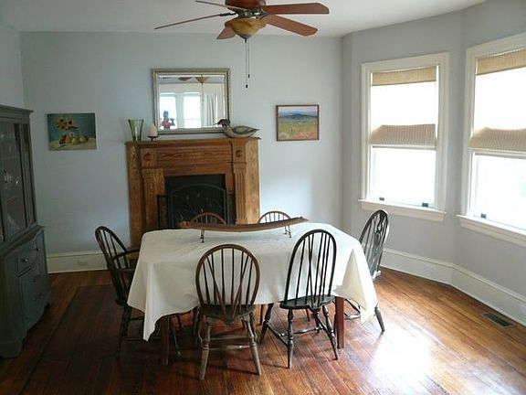 Dining Room with wood floors and south-facing windows