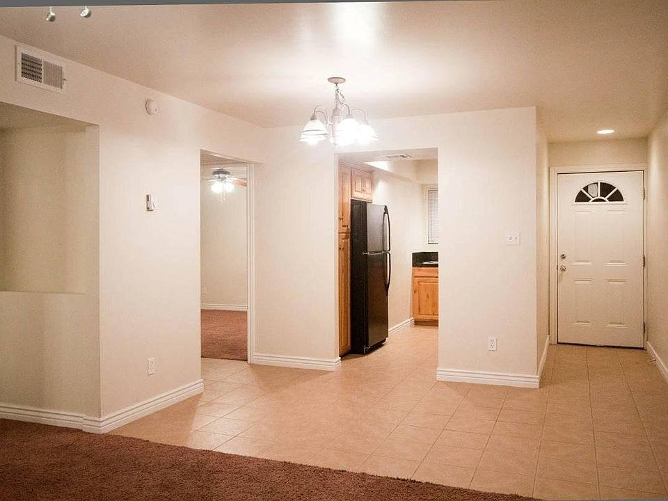 View from Living Room into Kitchen and Front Door