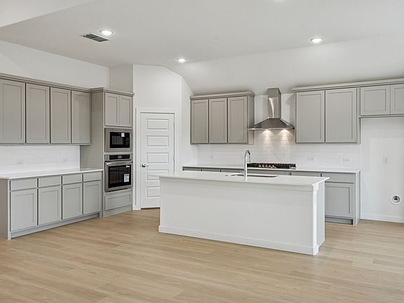 Kitchen in the Gilmour II home plan by Trophy Signature Homes - REPRESENTATIVE PHOTO