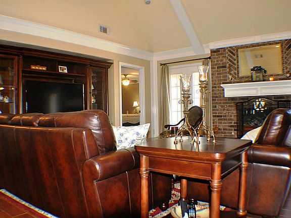 Large Den with tall ceiling and Fireplace