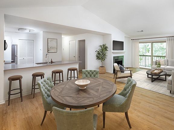 Renovated Package III dining and living room with hard surface flooring