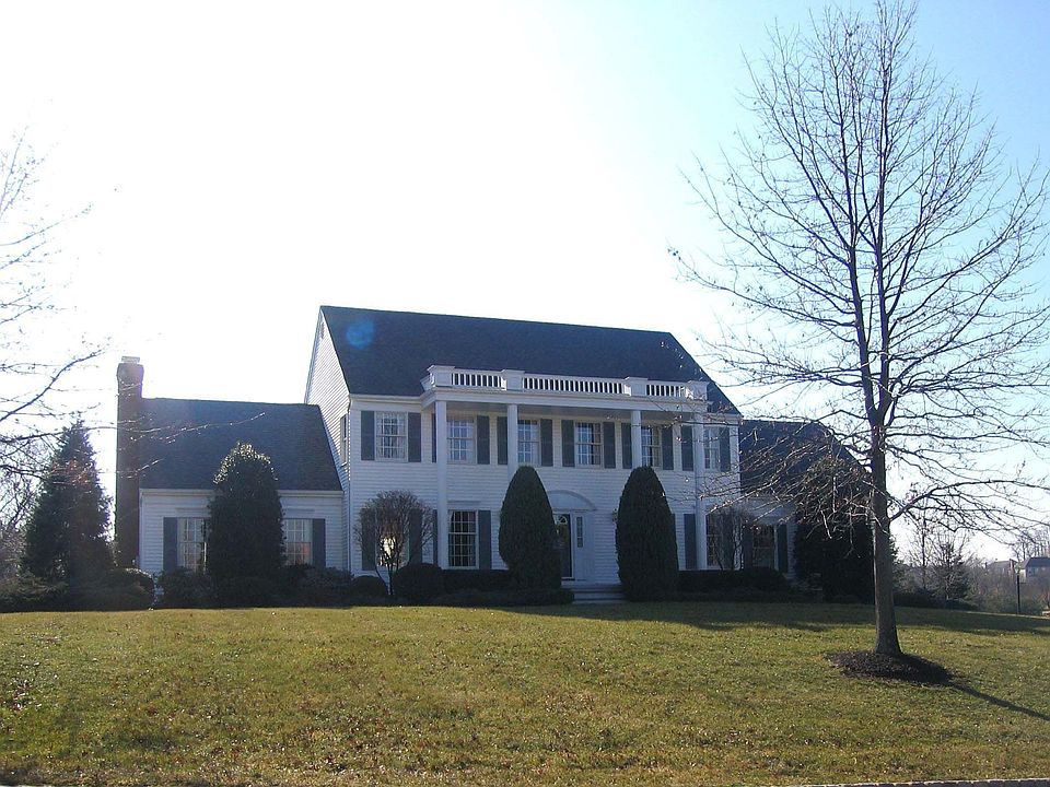Immaculate 4 bedroom Colonial in neighborhood setting w/public water & sewer