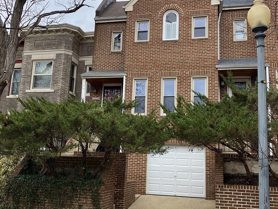 street view of house, garage and driveway