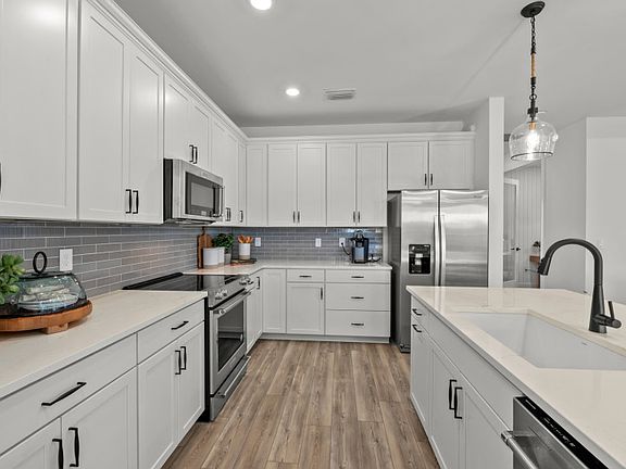 Ample cabinet space and storage options with walk-in pantry