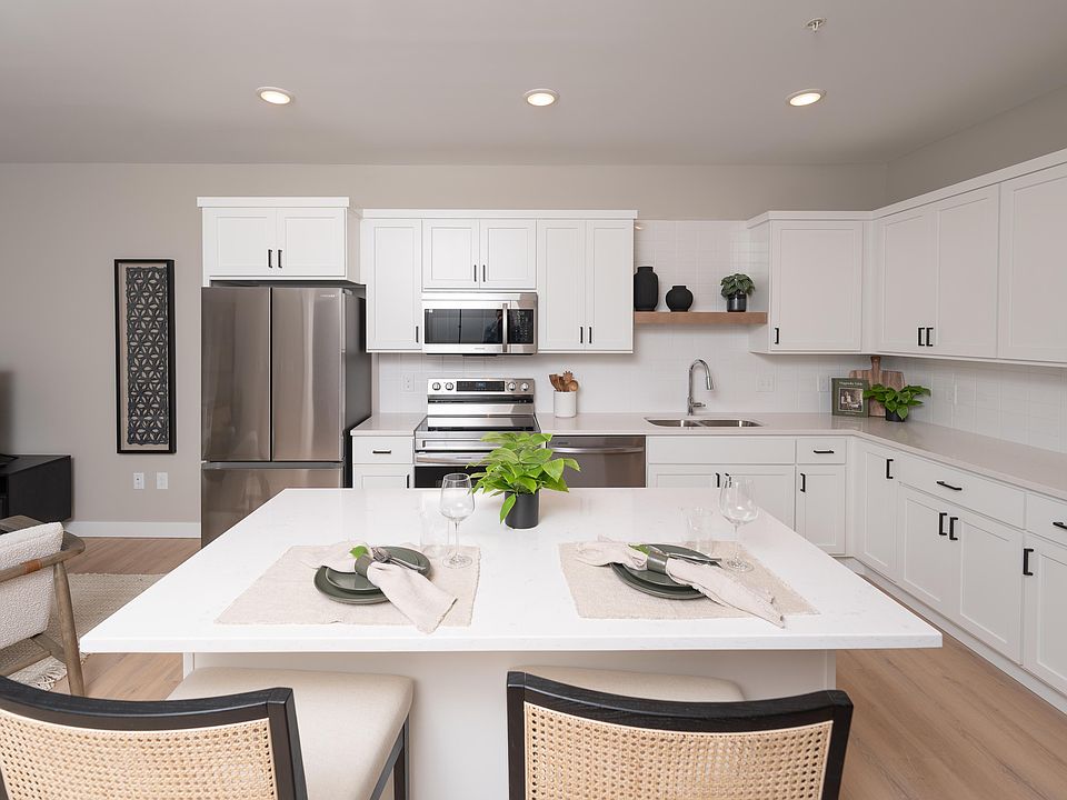 A bright kitchen space with room to dine comfortably at home.
