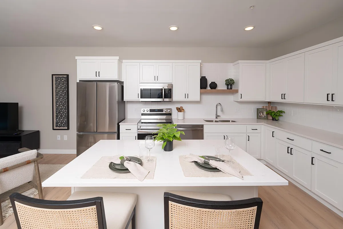 Photo 2 of 49 - Parallel Apartments - Roseville, MN A bright kitchen space with room to dine comfortably at home. - Parallel Apartments