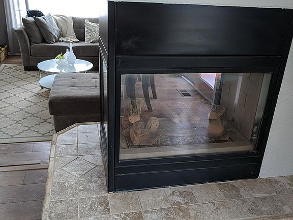 Three way fireplace - living room, dining and kitchen
