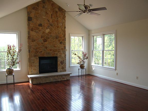 Fam. Rm with lots of light and raised-hearth stone fireplace.