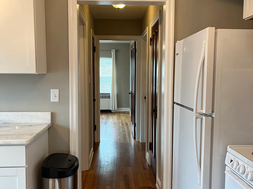 Hall way. Pantry on the right. Bathroom on the left. Past that another closet on the left and then the bedroom.
