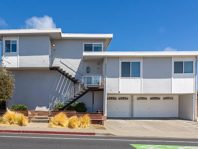 18 Orange Ave is the top floor unit to the left.