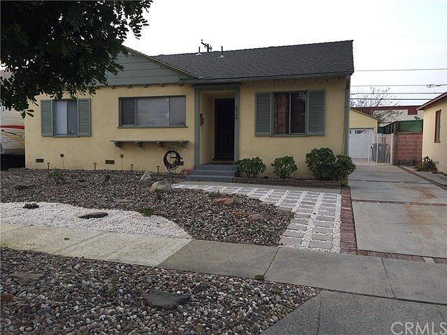 Beautifully landscaped, drought-tolerant, front yard!  Long driveway leading to two-car garage!