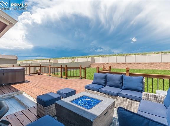 Expansive wood deck with plenty of relaxing and entertainment space. Nothing on the bare berm behind you and new sod to boot!