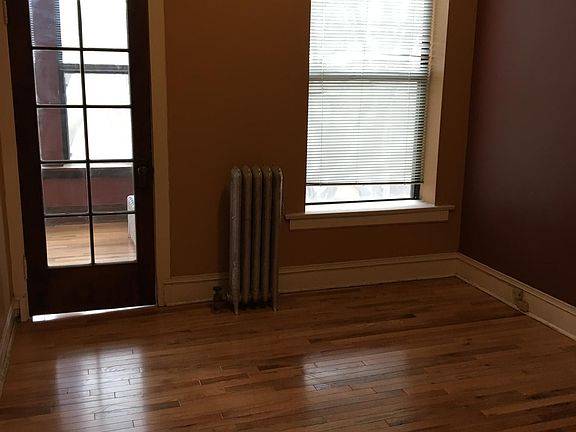 bedroom with door to sunroom